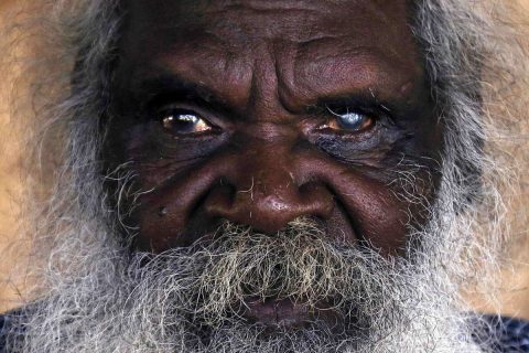 Seventy-six-year-old Australian Aboriginal elder Jimmy Burnyila of the Yolngu people sits at his house located on the outskirts of the community of Ramingining located in East Arnhem Land
